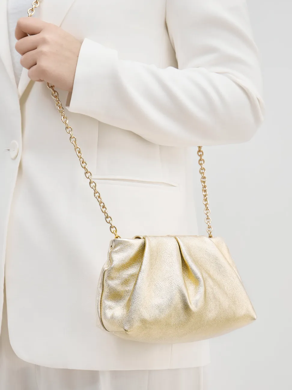 Konstantin Starke – Abendtasche aus Metallicleder Gold