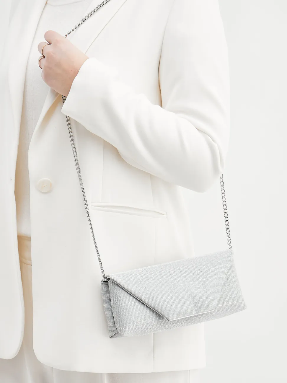 Konstantin Starke – Clutch aus Metallic-Textil silber