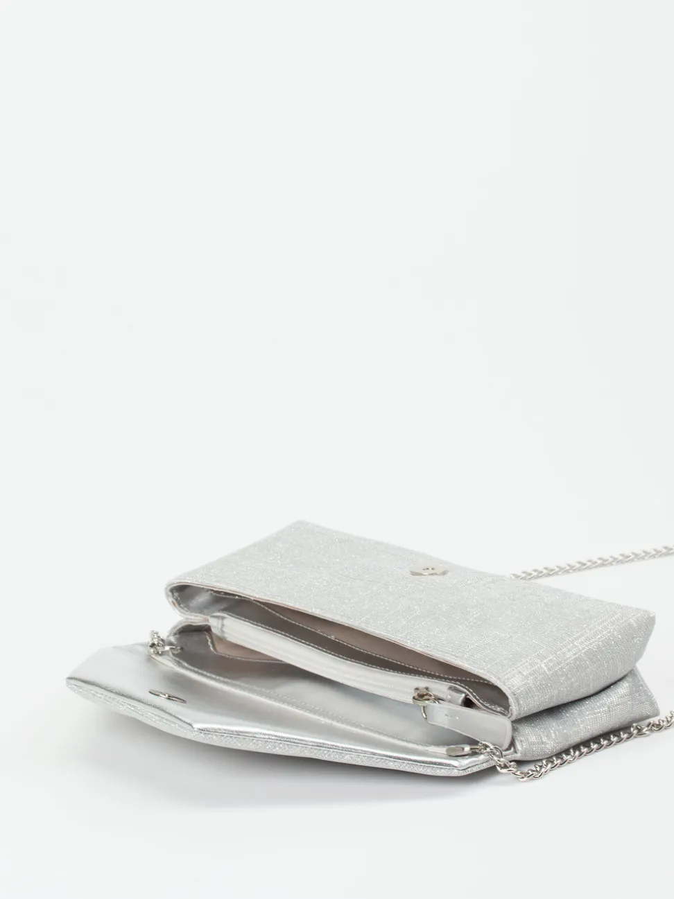 Konstantin Starke – Clutch aus Metallic-Textil silber