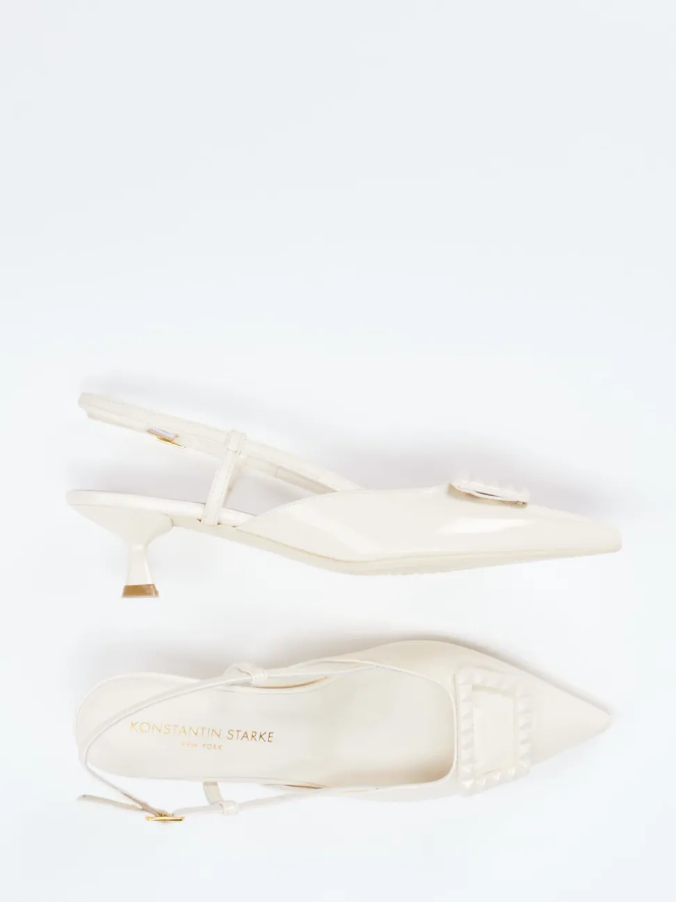 Konstantin Starke – Slingback-Pumps aus Lackleder cremeweiß
