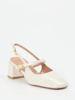 Konstantin Starke – Slingback-Pumps aus Lackleder cremeweiß