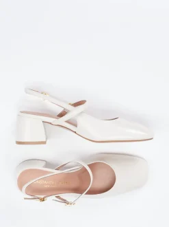 Konstantin Starke – Slingback-Pumps aus Lackleder cremeweiß