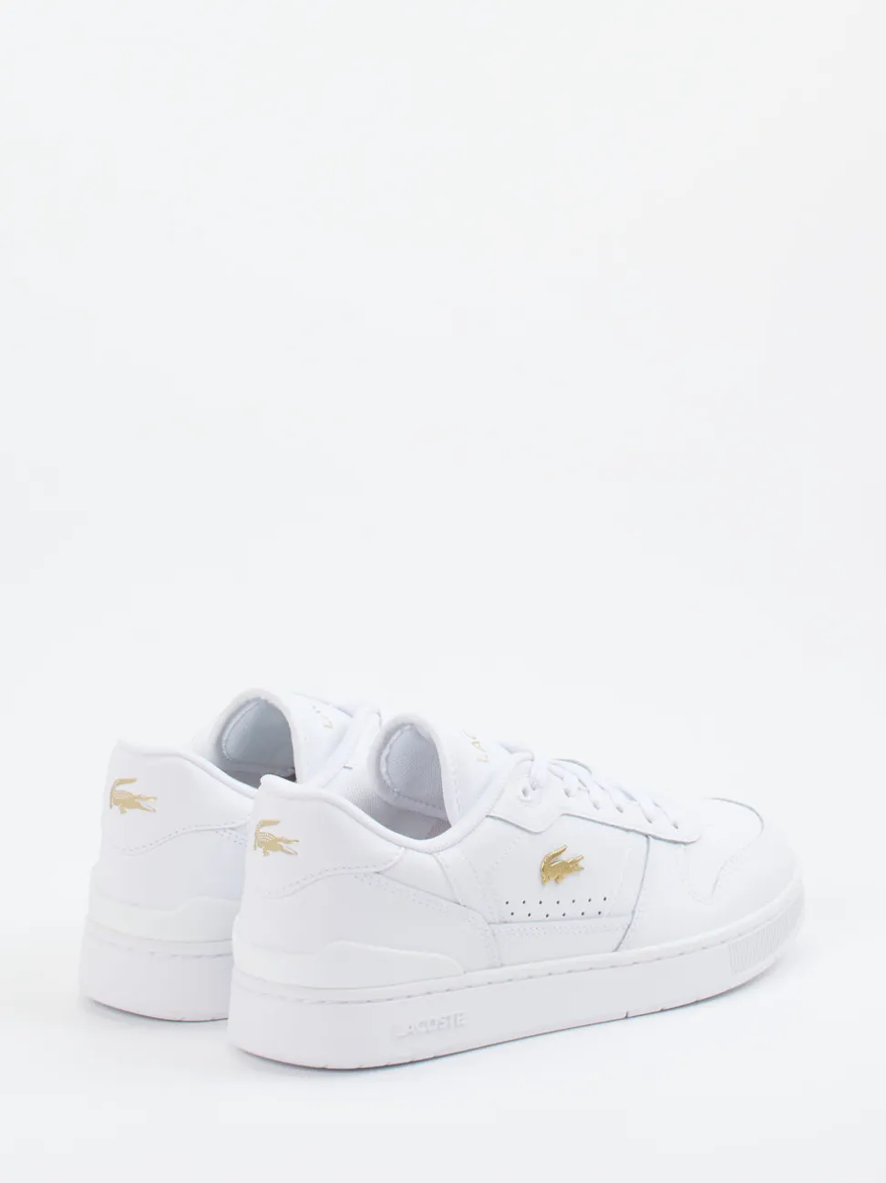 Lacoste – Sneaker aus Glattleder weiß mit Goldakzenten