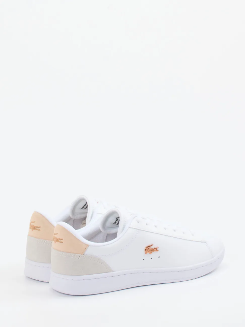 Lacoste – Sneaker aus Leder in Weiß mit Roségold