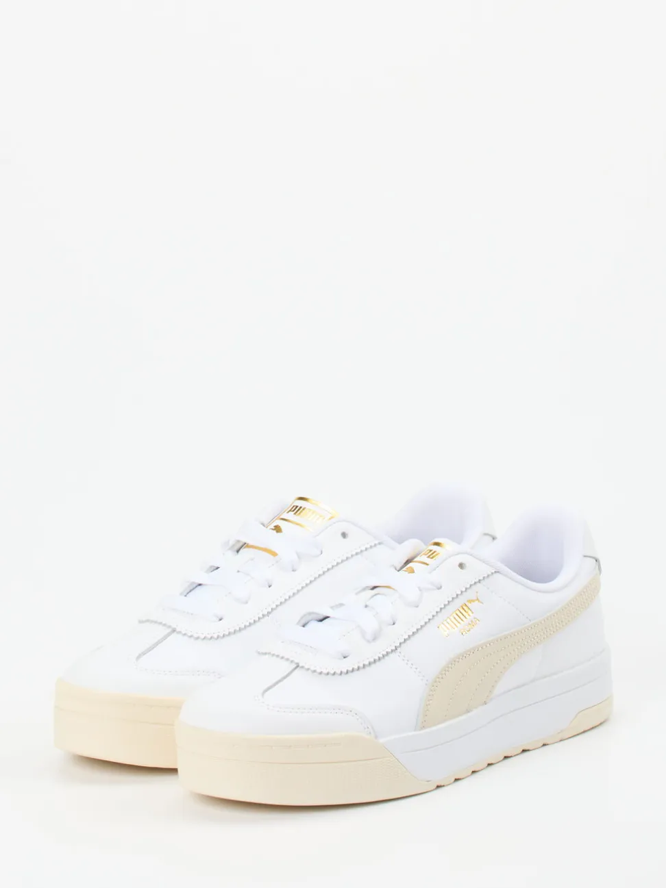 Puma – Sneaker aus Glattleder in Weiß mit Goldakzenten