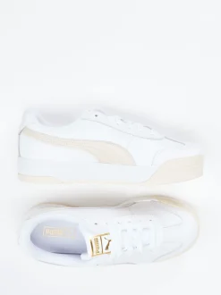 Puma – Sneaker aus Glattleder in Weiß mit Goldakzenten