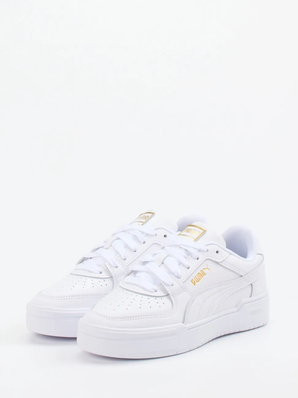 Puma – Sneaker aus Glattleder weiß mit Golddetails