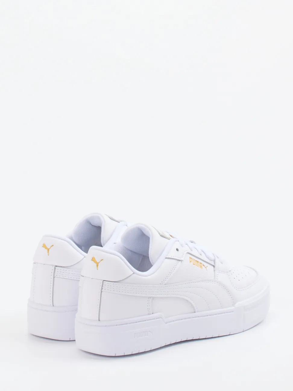 Puma – Sneaker aus Glattleder weiß mit Golddetails