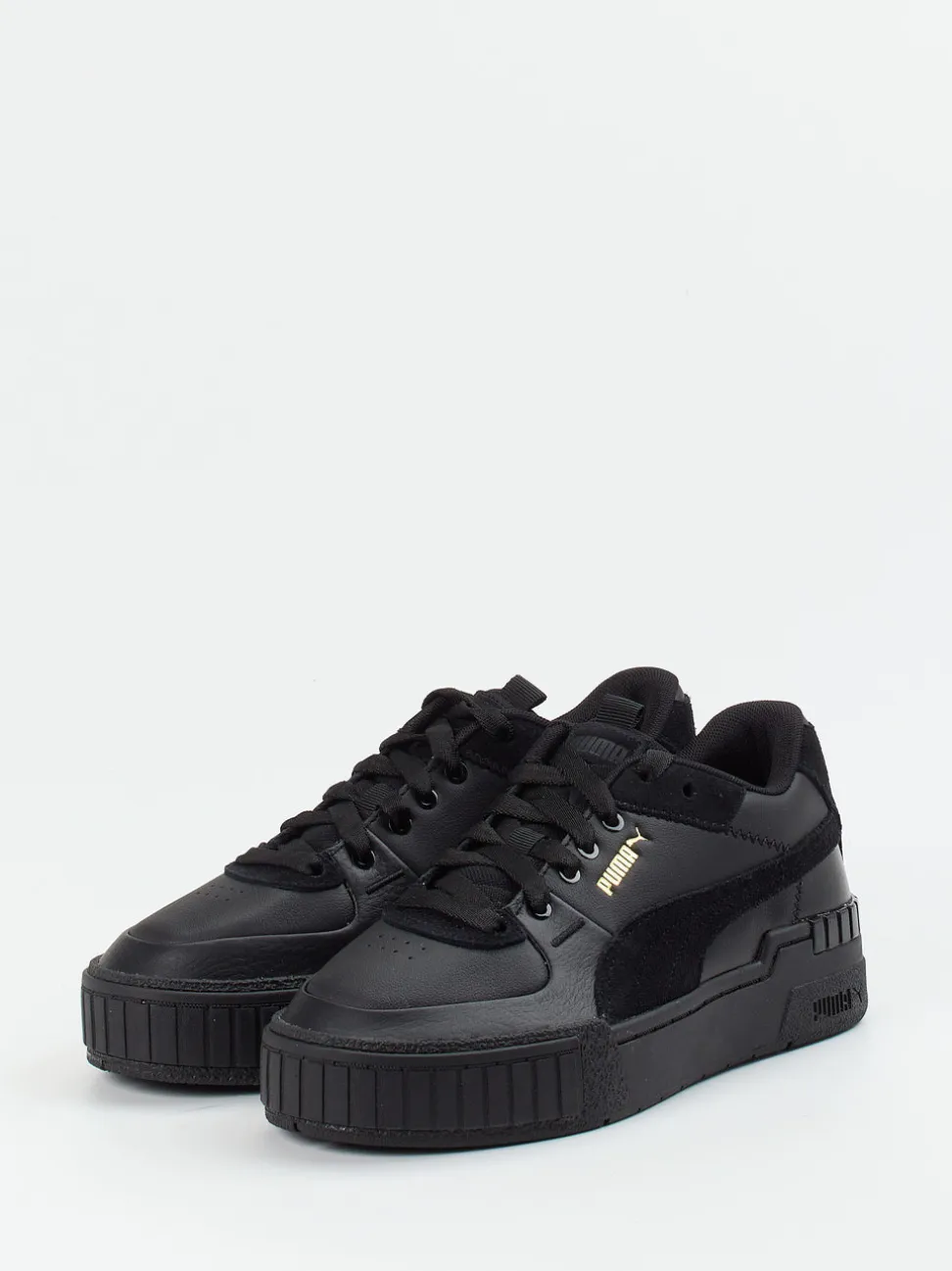 Puma – Sneaker aus Leder in Schwarz mit Goldakzenten