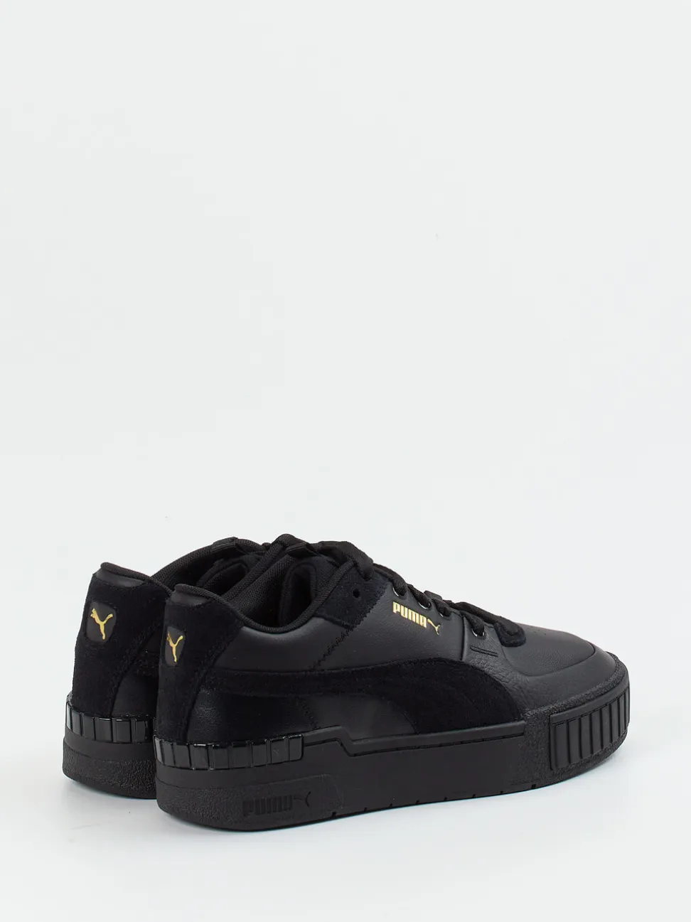 Puma – Sneaker aus Leder in Schwarz mit Goldakzenten