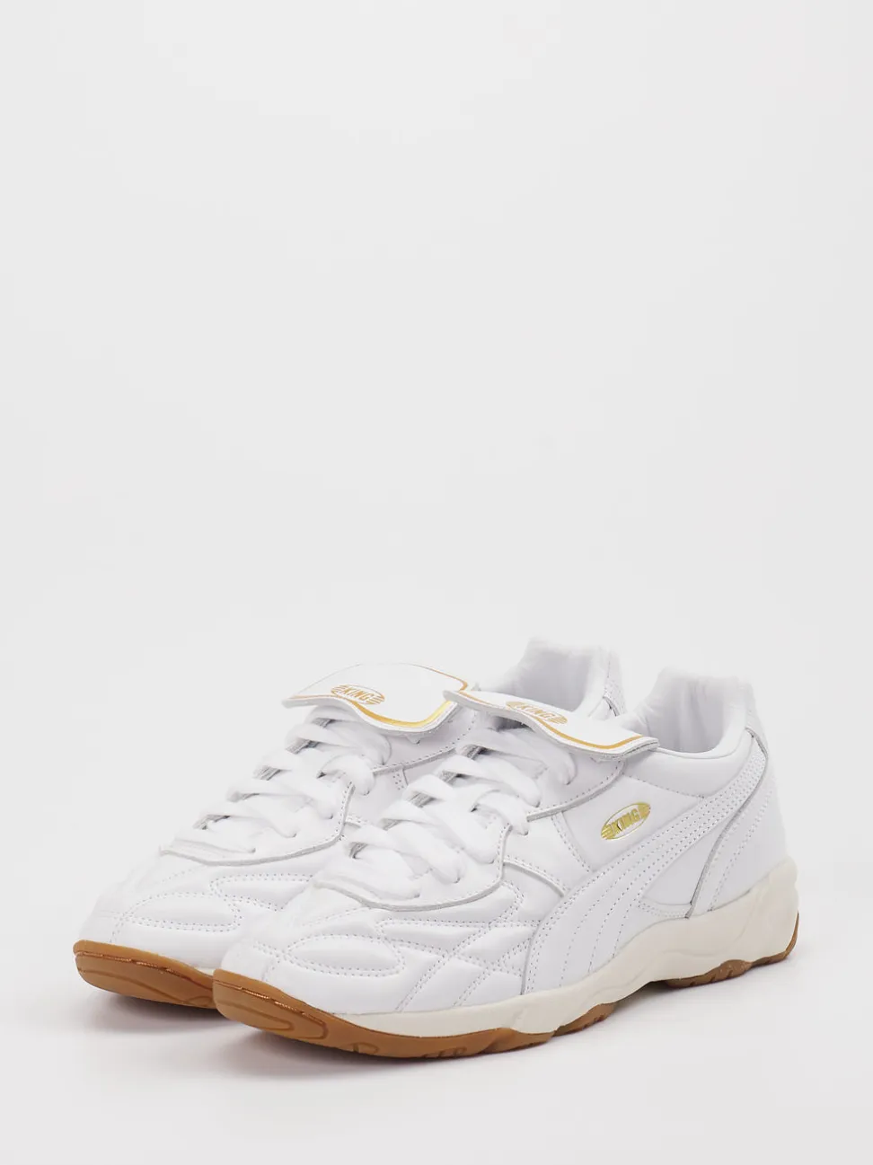 Puma – Sneaker aus Leder in Weiß mit Gold-Detail