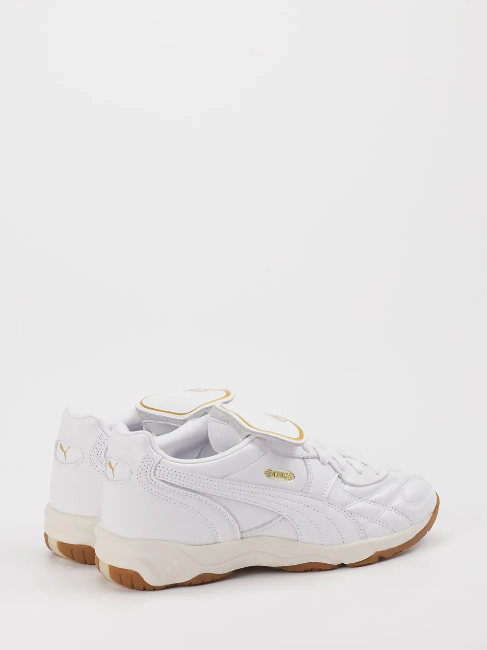 Puma – Sneaker aus Leder in Weiß mit Gold-Detail