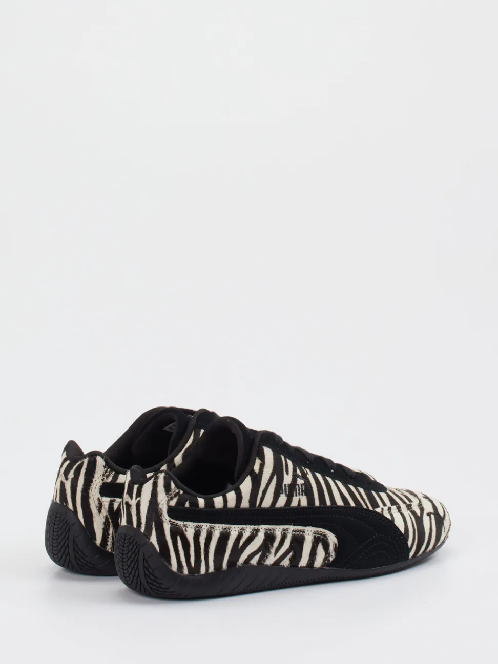 Puma – Sneaker aus Veloursleder und Fellstruktur schwarz