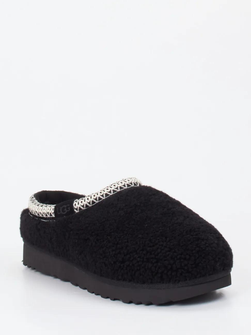 UGG – Hausschuh aus Fell in Schwarz mit Bouclé